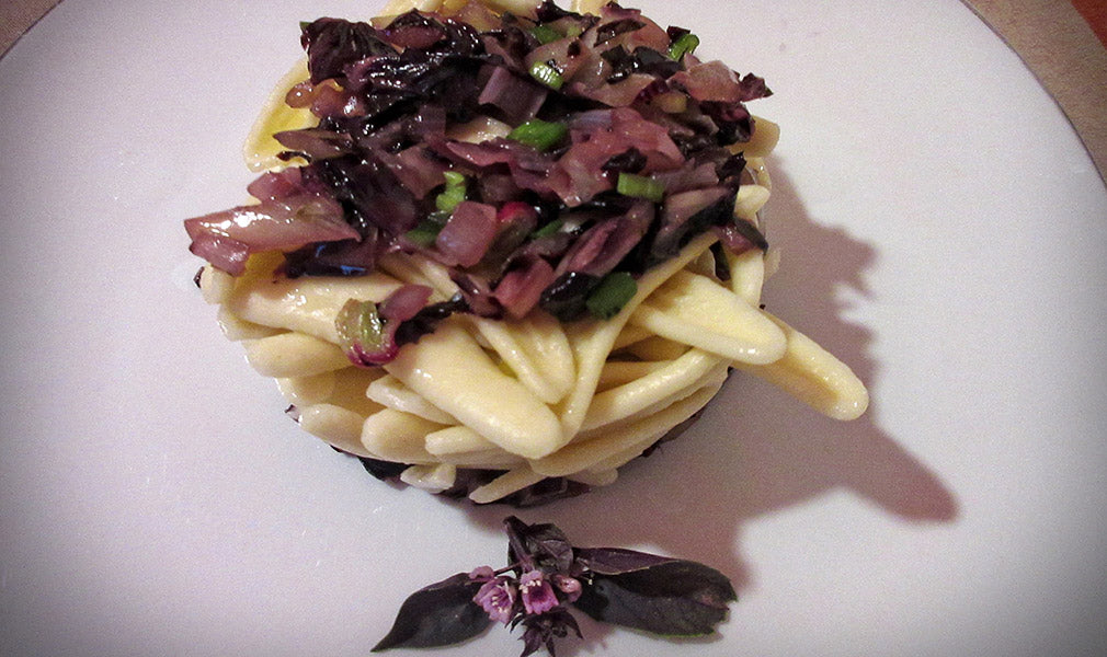 Pasta with red radicchio, Tropea onion, and purple basil